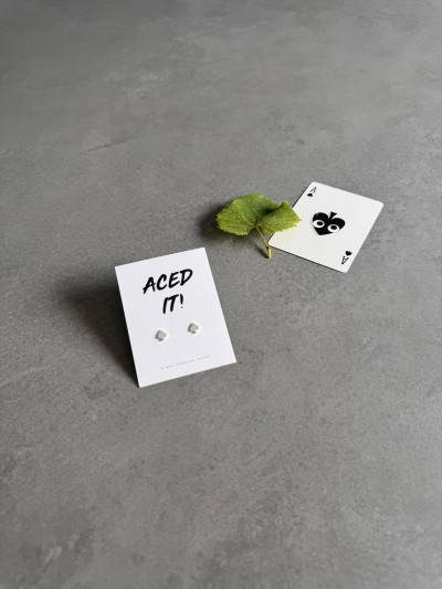 Sterling silver ace of spades earrings on a 'Aced It!' message card. Sterling silver ace of spades earrings on a 'Aced It!' message card.