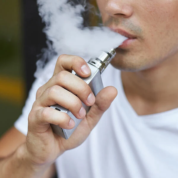 Man vaping mod style vape device with large cloud