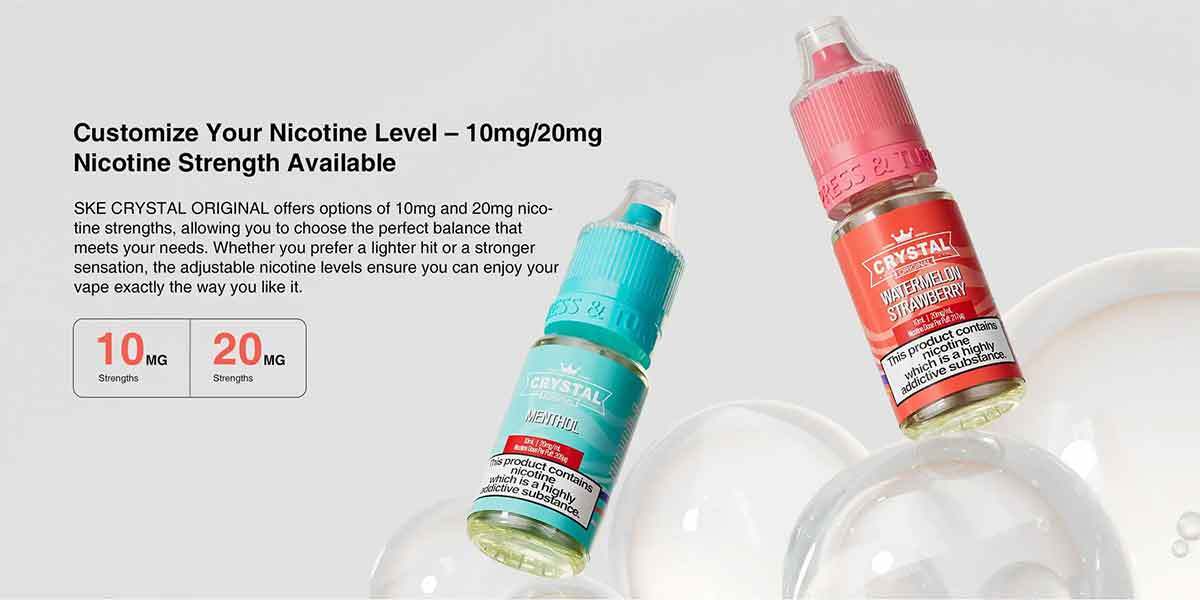 Two bottles of SKE Crystal vape juice with floating bubbles, showing nicotine strength options.