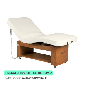 Avanora electric lift table, backrest raised, showing Spa Luxe logo on wood cabinet base