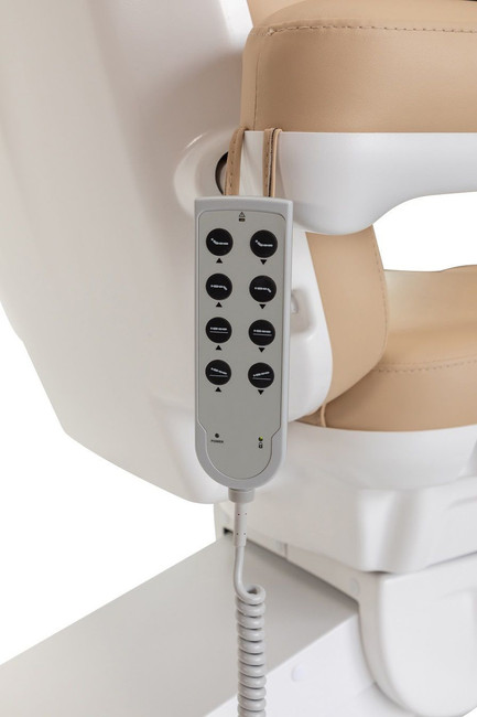 Detail of the electric controller for the Beige tan Sibella Medical Spa IS240 Electric Exam Chair and Facial Bed by Spa Luxe.