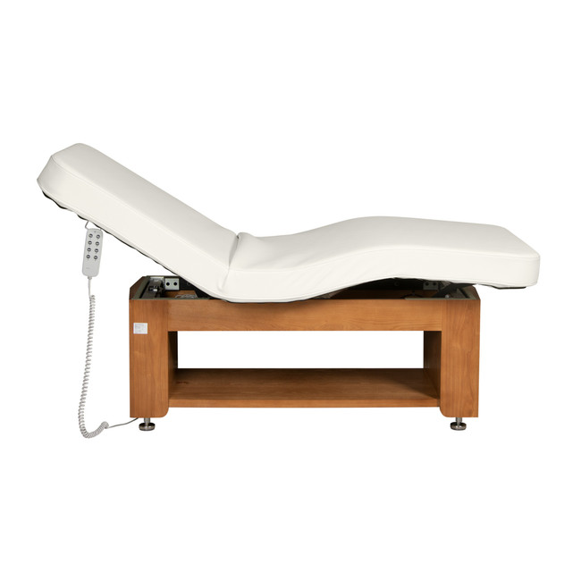 Side profile of Avanora electric treatment table in lowered position with reclined backrest