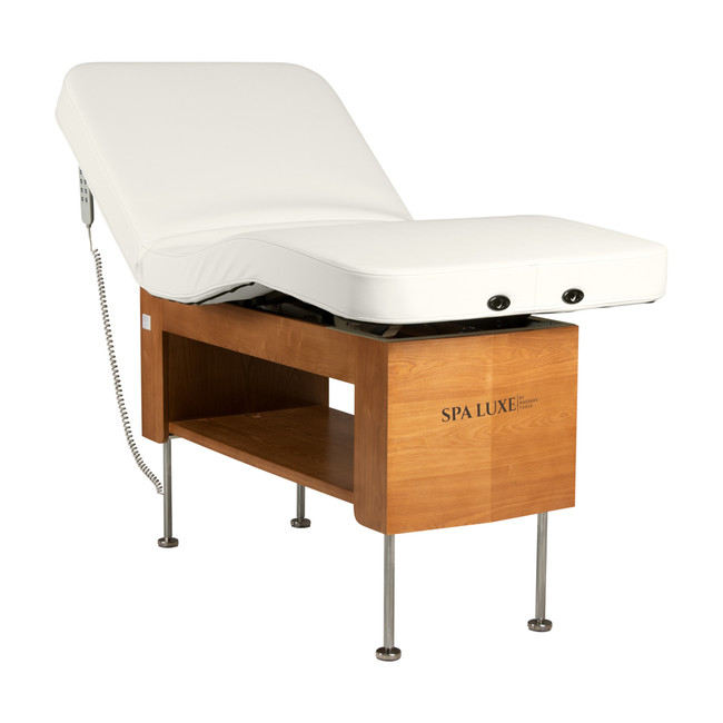 Avanora electric massage table raised on stainless steel legs, backrest inclined
