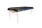 3/4 Black padded Spa Luxe Portable Massage Table.