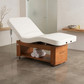 Avanora electric massage table in a spa treatment room with towels,
