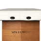 Close-up of Spa Luxe by Massage Tools logo on wood base, with oval fittings on end of upholstered top