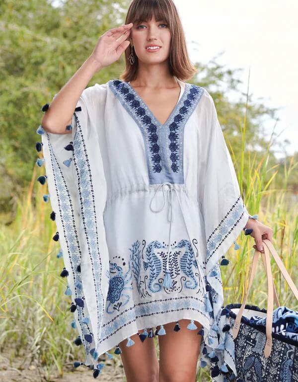 A woman in a sea life beach cover-up