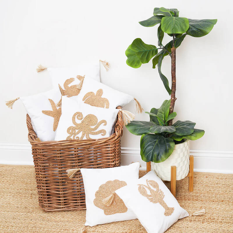 sea life throw pillows in wicker basket
