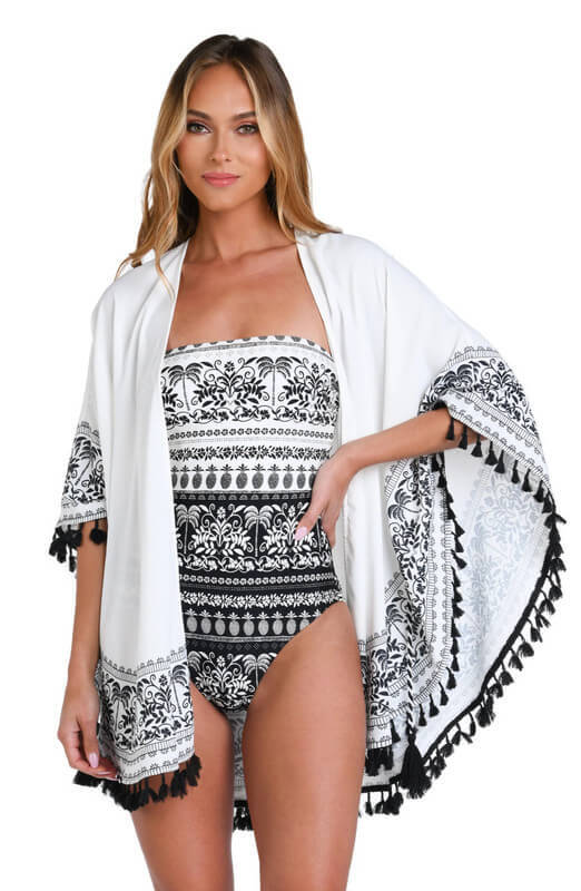 woman in black and white swimsuit with a matching cover-up