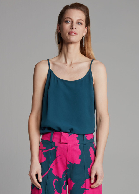 POM Blue top with adjustable straps, dragonfly brooch, and loose fit. Made of 100% recycled polyester.