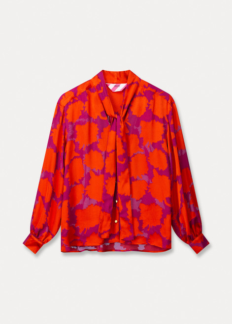 POM Pink blouse with orange floral print, gold buttons, and a bow tie. Wide fit with long sleeves.
