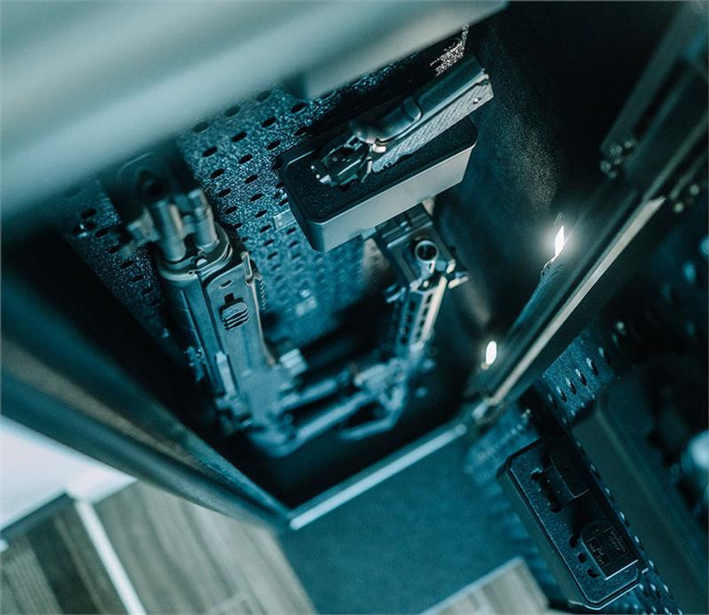 Close-up of NRS200i-BK interior with mounted rifles using barrel mounts and base plate for organized firearm storage.