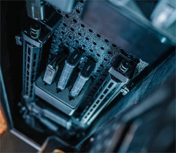 Interior of Vaultek NRS200i-BK ViSN Smart Safe showing storage for two rifles, handguns, and modular pegboard system.