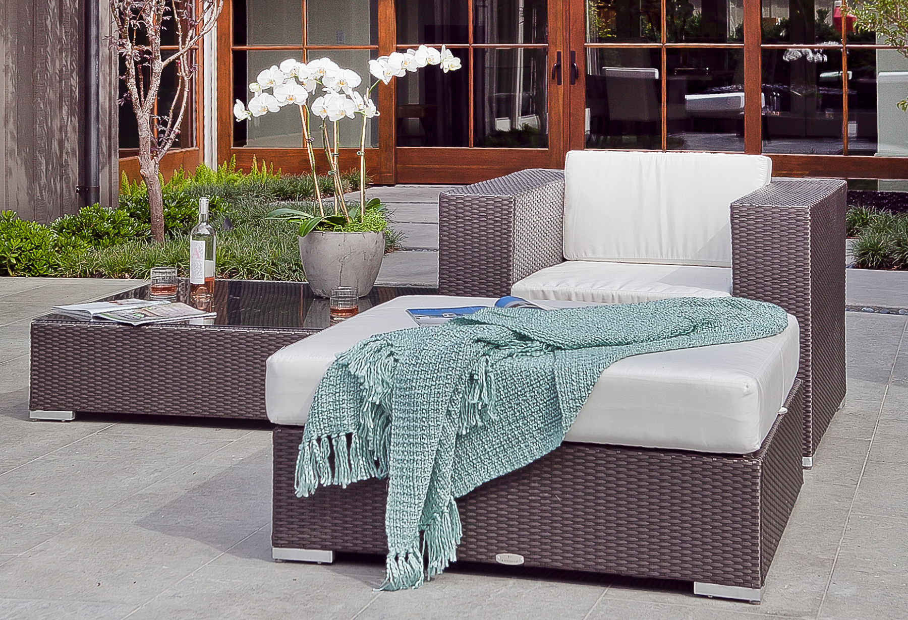 The Tangier collection combines versatility, modern sophistication, and customizable design to elevate any outdoor setting with its sleek sectional pieces, wide arms, and aluminum feet.