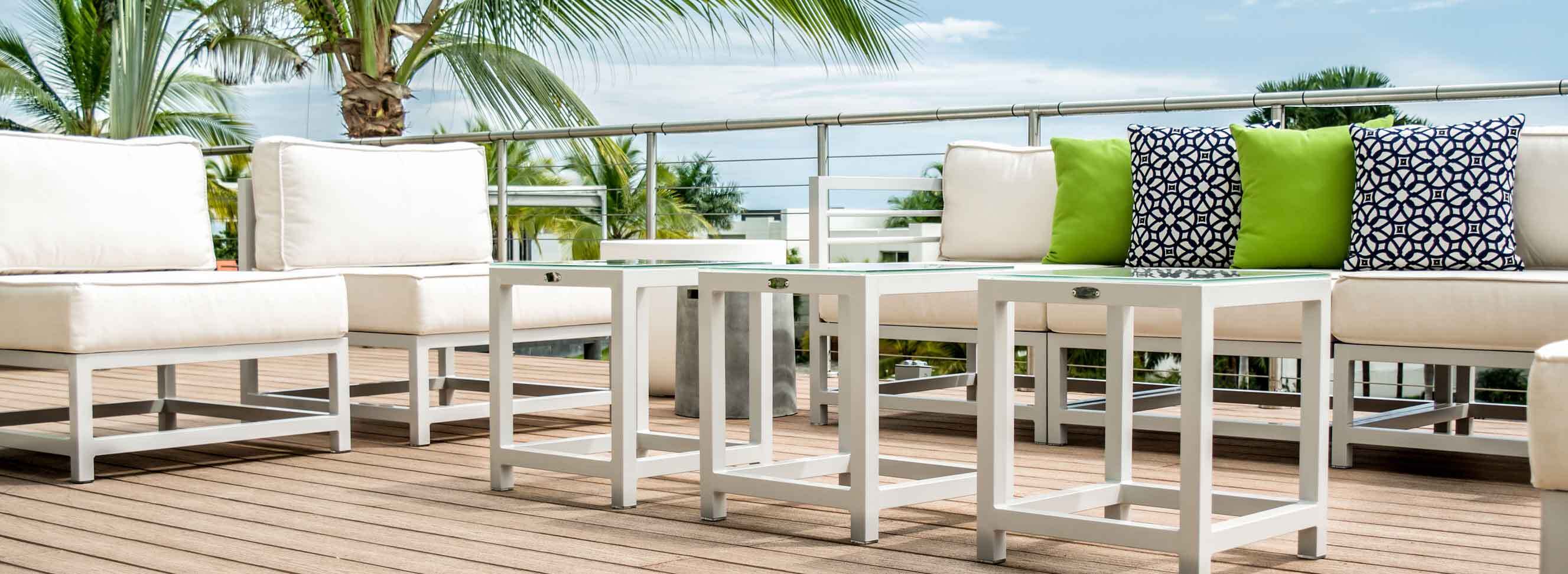 Toleadon Collection of outdoor furniture by Kannoa, including sofas, armchairs, a side table and coffee table
