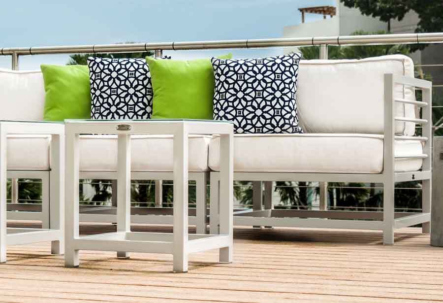 Toleadon Collection of outdoor furniture by Kannoa, including sofas, armchairs, a side table and coffee table