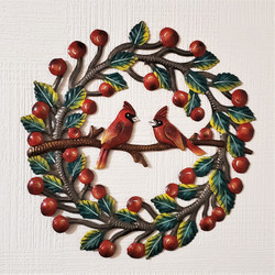 Fair trade recycled steel drum cardinals inside a berry wreath wall hanging from Haiti
