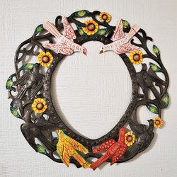 Fair trade recycled steel drum birds and flowers in a wreath wall hanging from Haiti