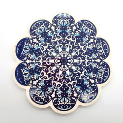 Fair trade stamped pattern ceramic hot pad trivet with scalloped edge from Turkey