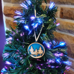 Fair trade laser cut and brush painted wood sleigh Christmas ornament from Chile