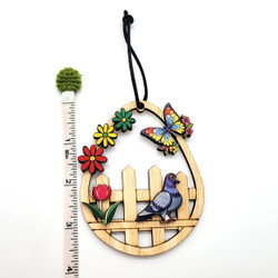 Fair trade eucalyptus wood ornament with butterflies from Chile