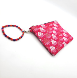 Fair trade pink and white Dhaka cotton fabric clutch wristlet from Nepal