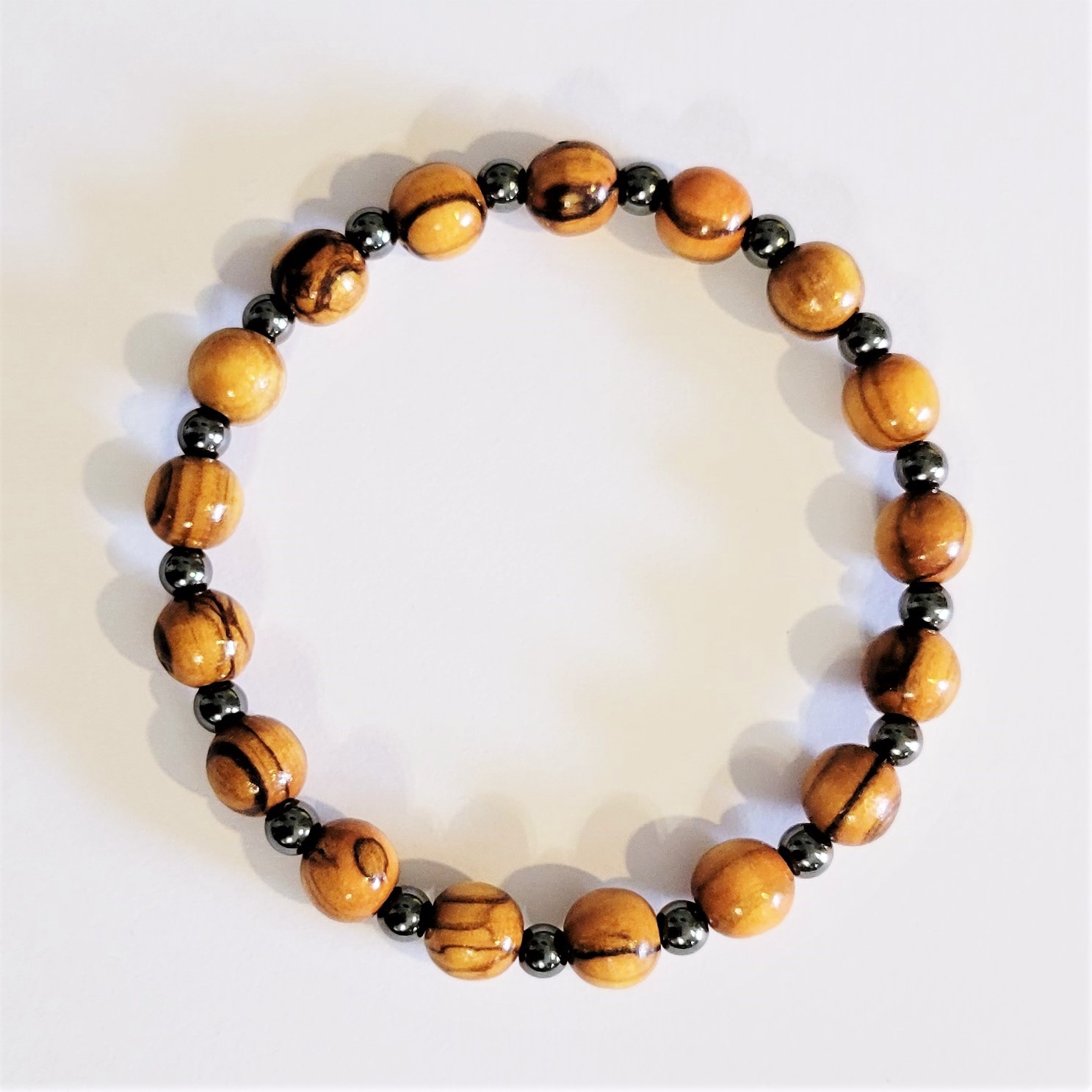 Carved Olive Wood and Hematite Bracelet from West Bank - The Silk Road ...