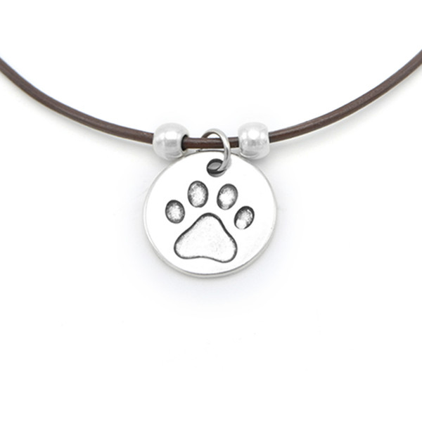 LILO Collections Paw Print Disc Skinny leather necklace, pictured on brown cord