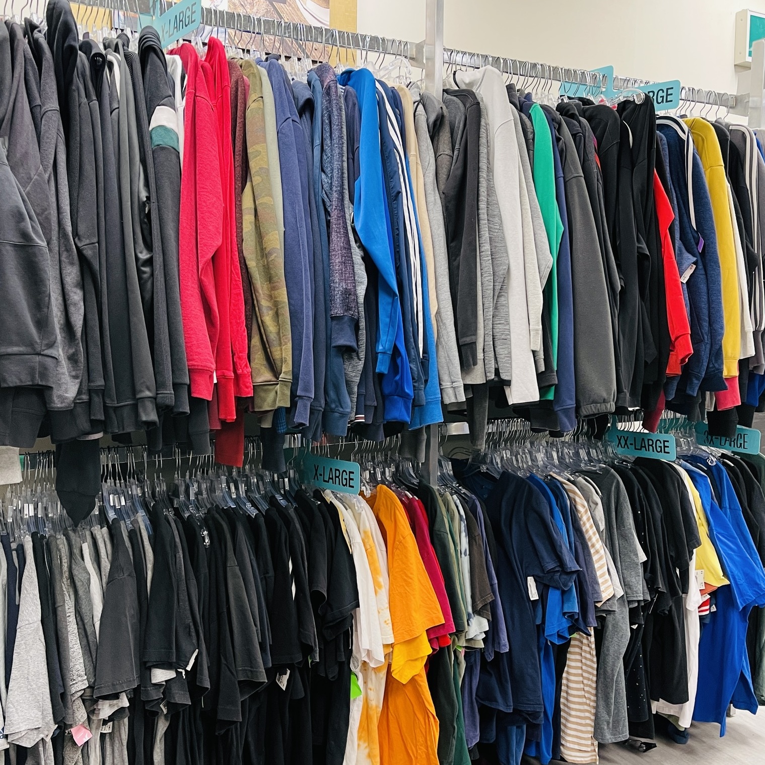 Plato's Closet London South Interior mens section showing racks with clothes