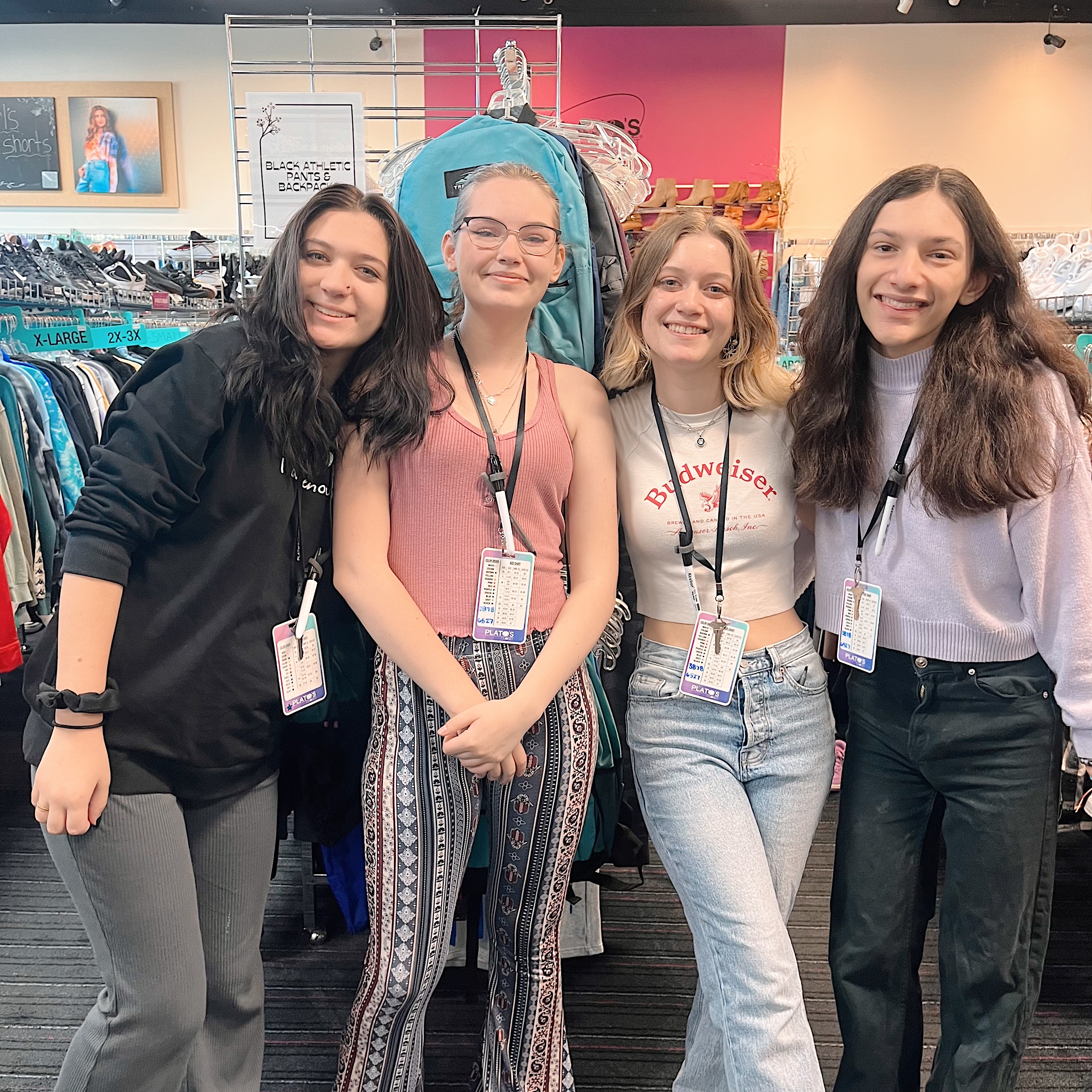 a group of employees posing together and smiling