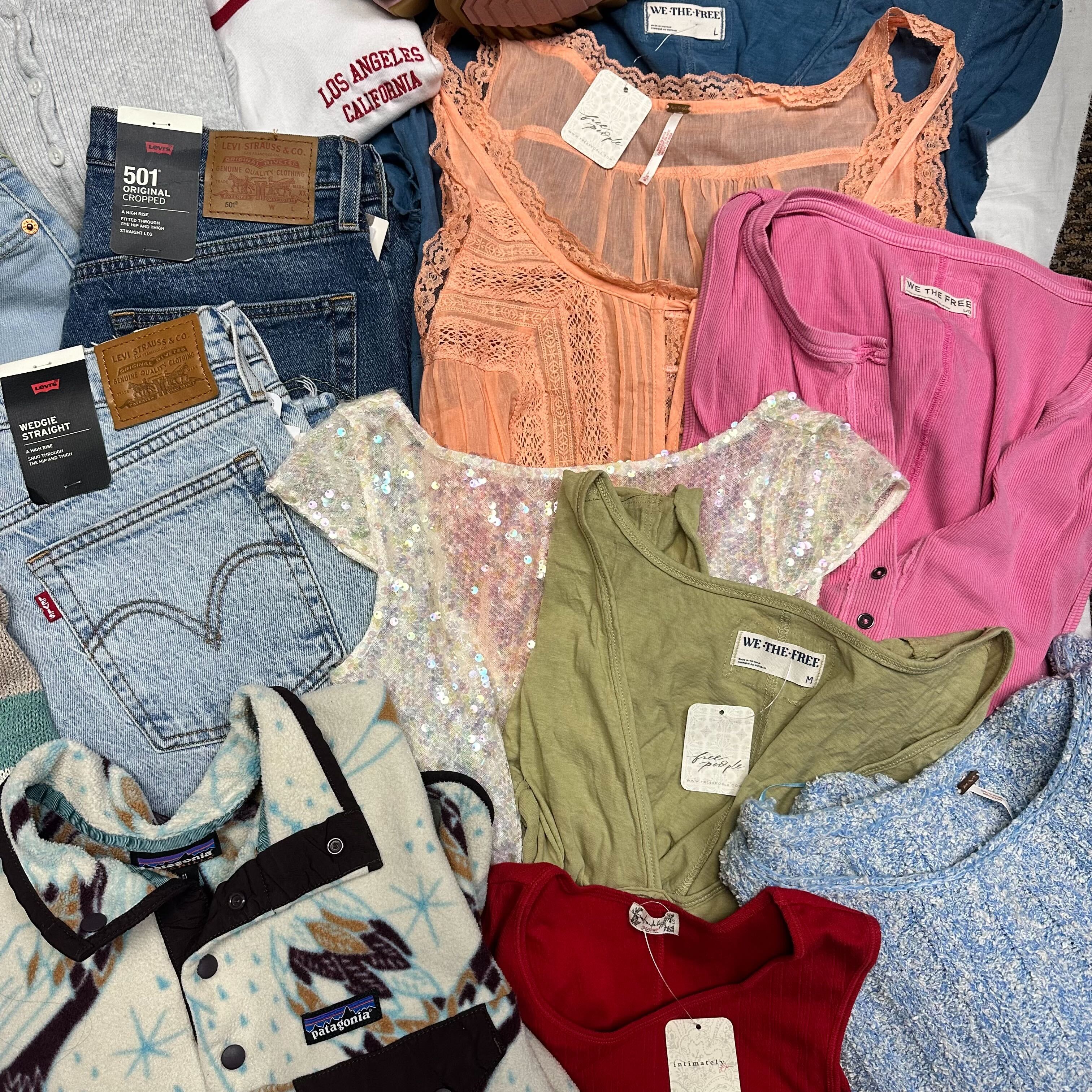 a flatlay of several pieces of clothing nicely folded