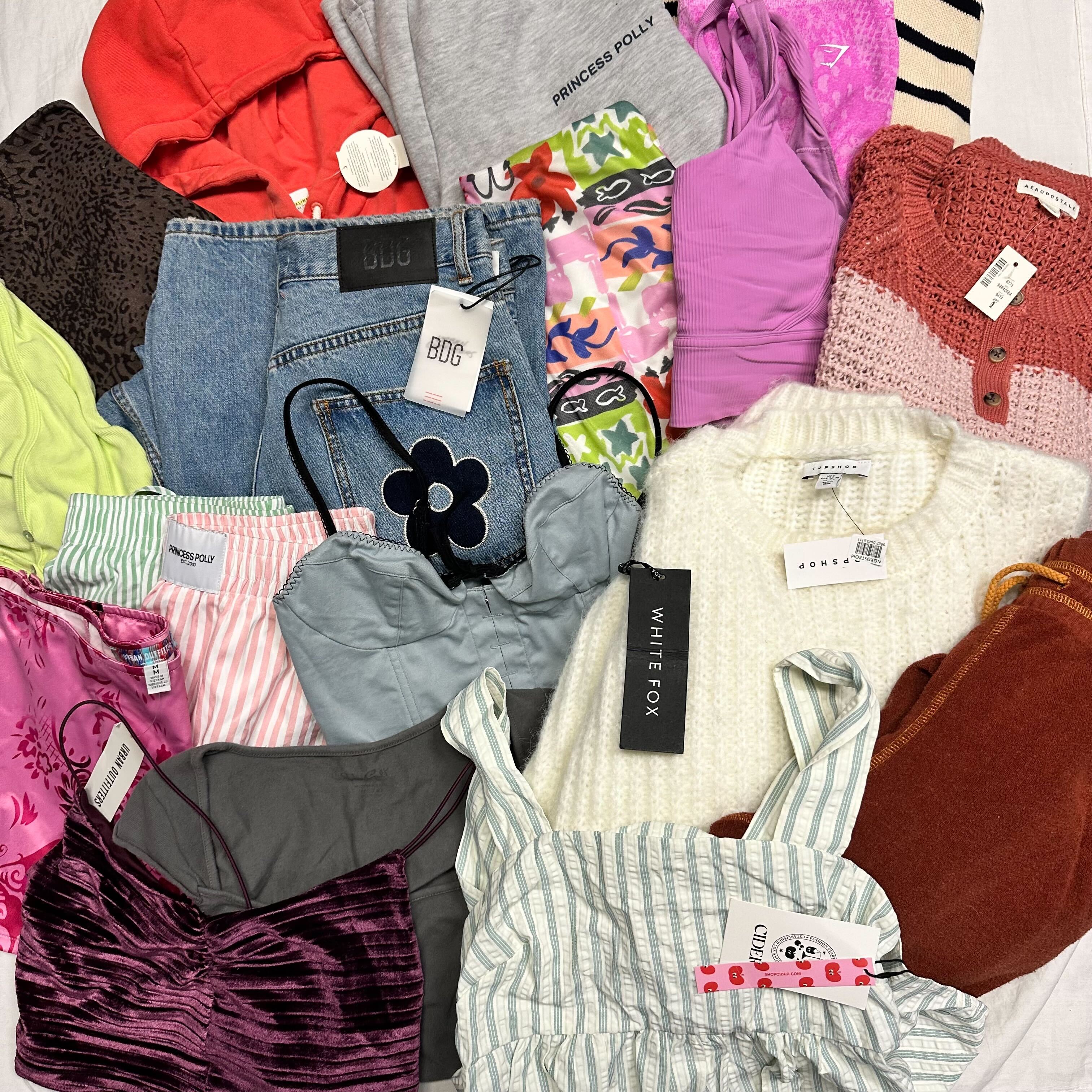 a flatlay of several pieces of clothing nicely folded