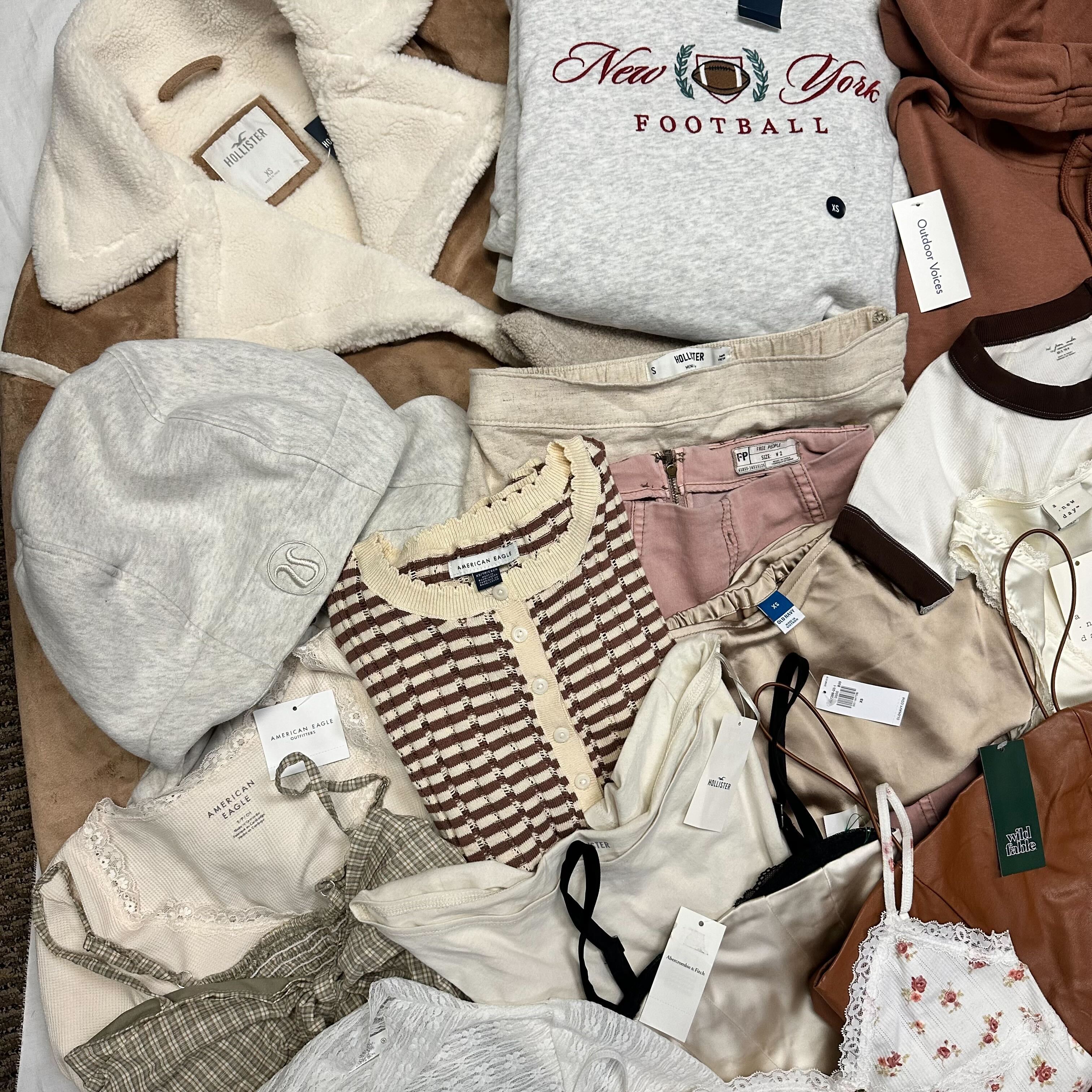 a flatlay of several pieces of clothing nicely folded