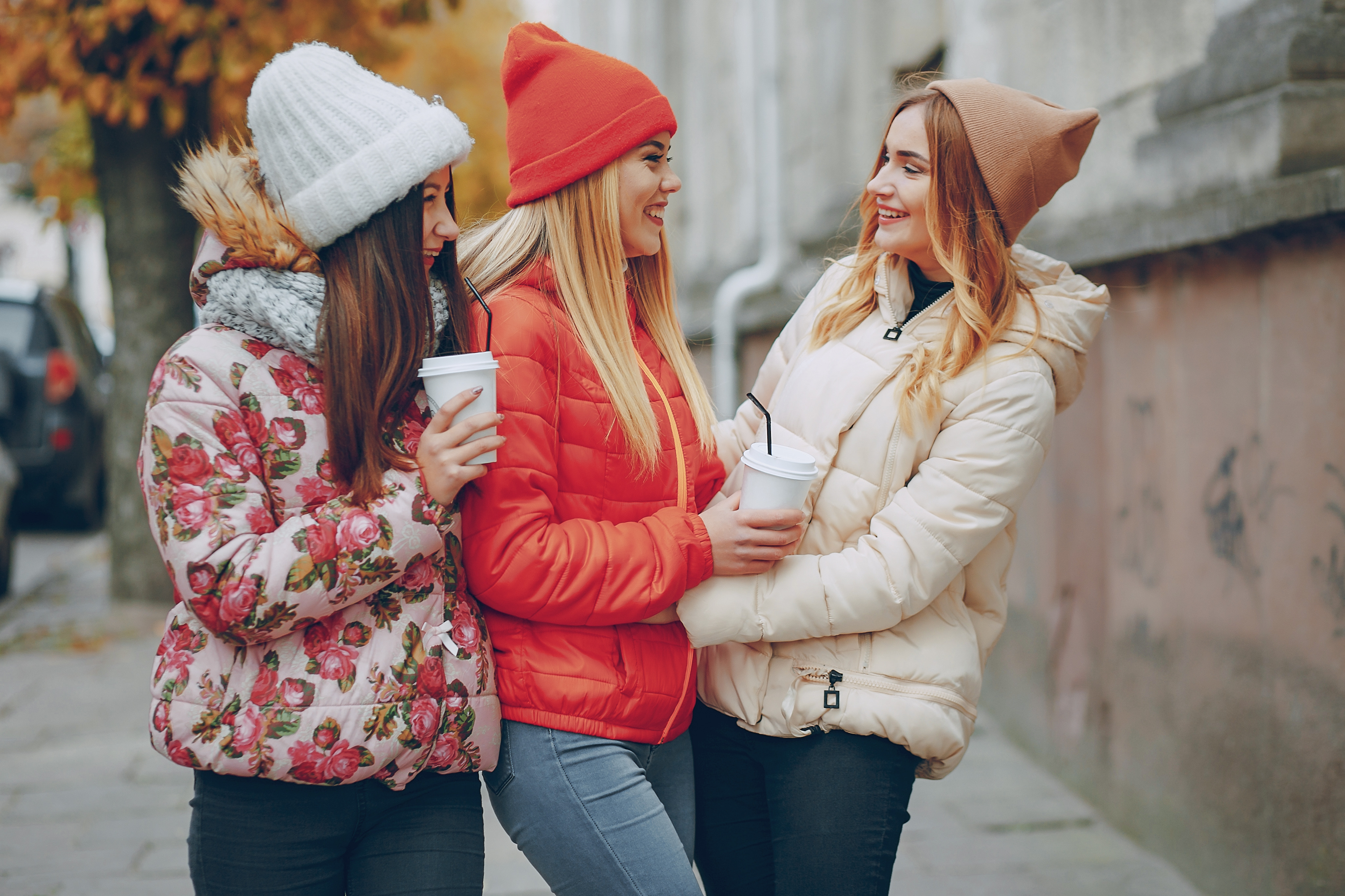 Teenage girls wearing winter clothes and smiling