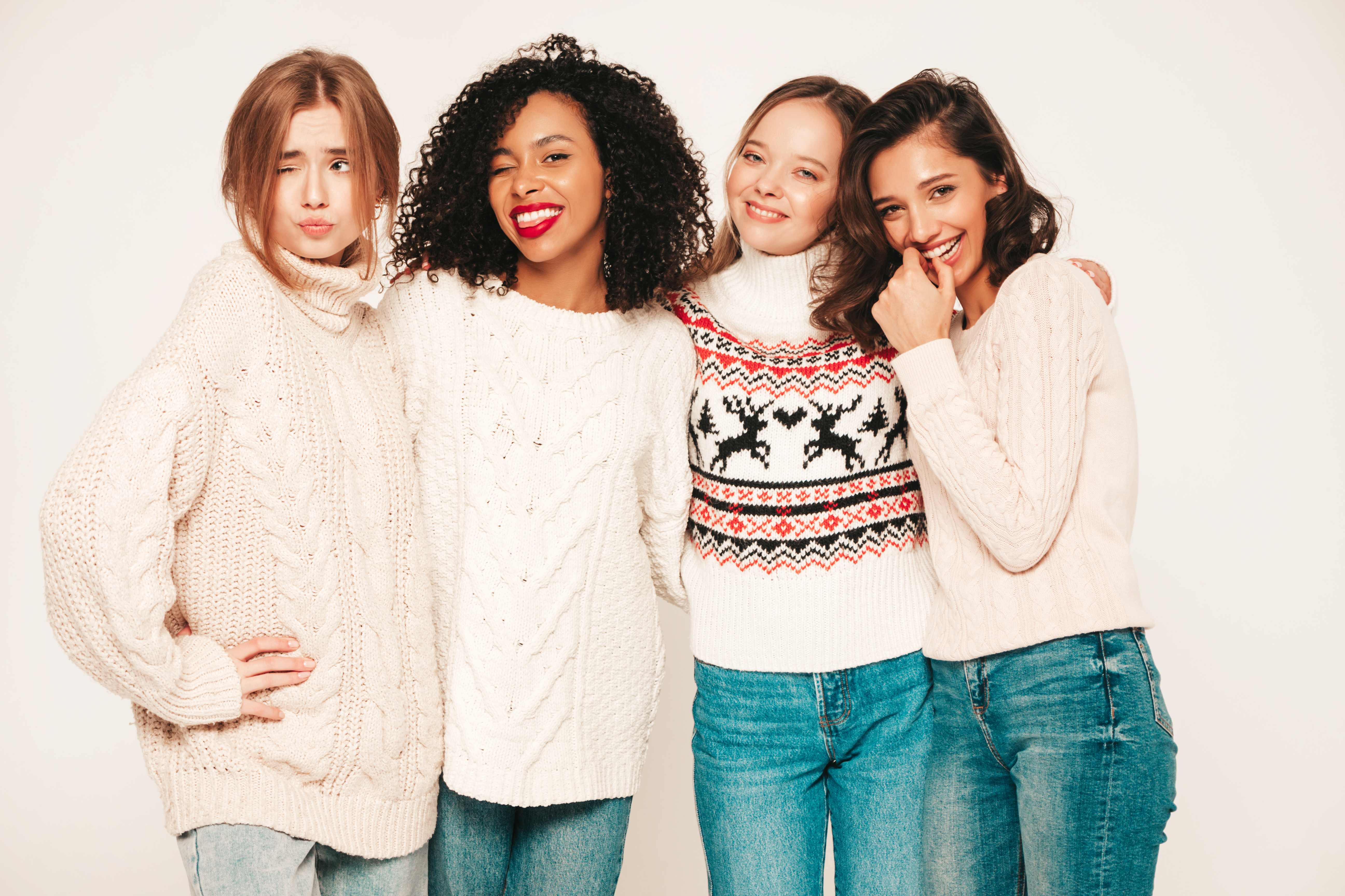 Teenage girls wearing winter clothes and smiling