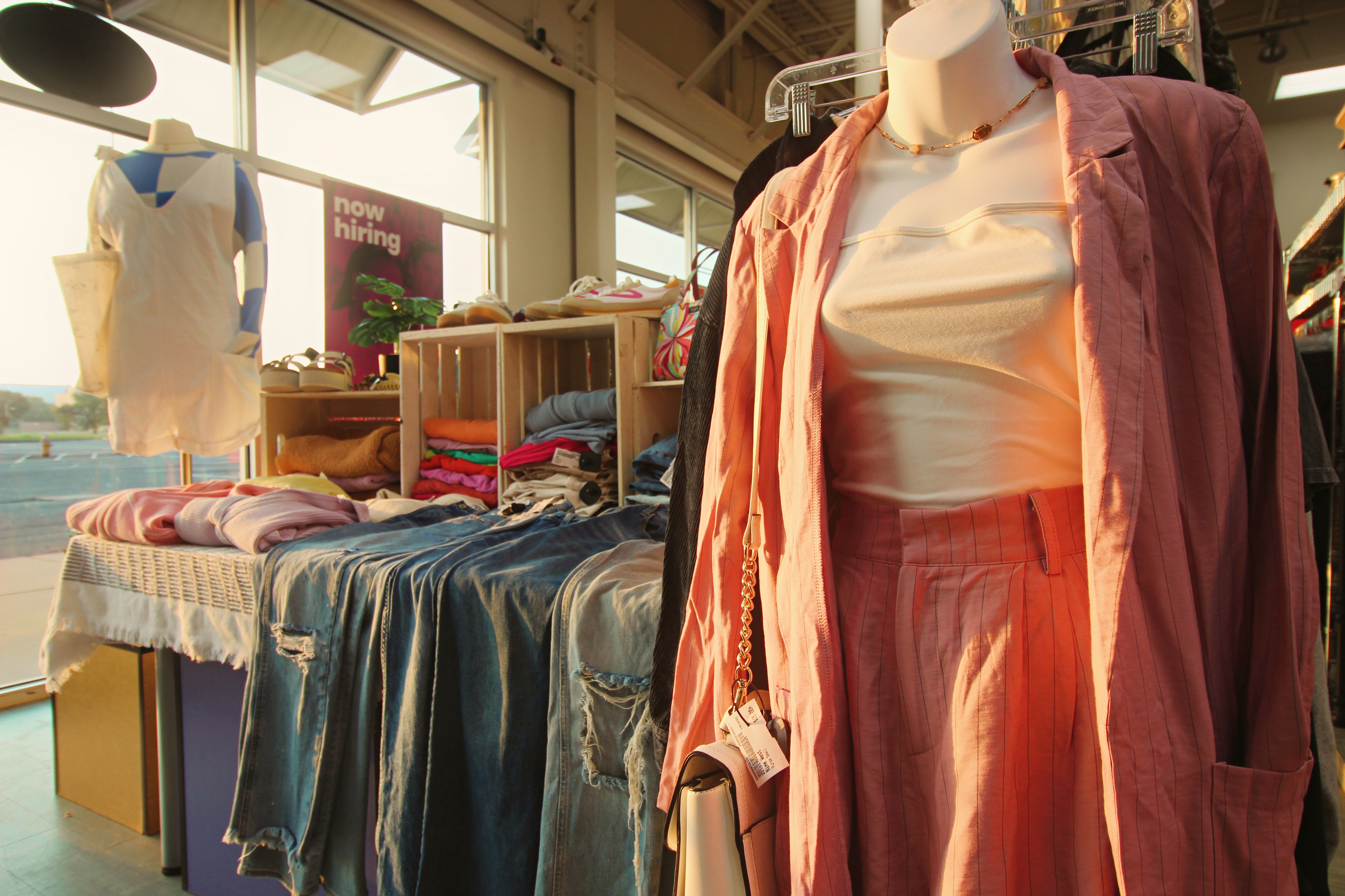 Clothing display of colorful women’s clothing and jeans