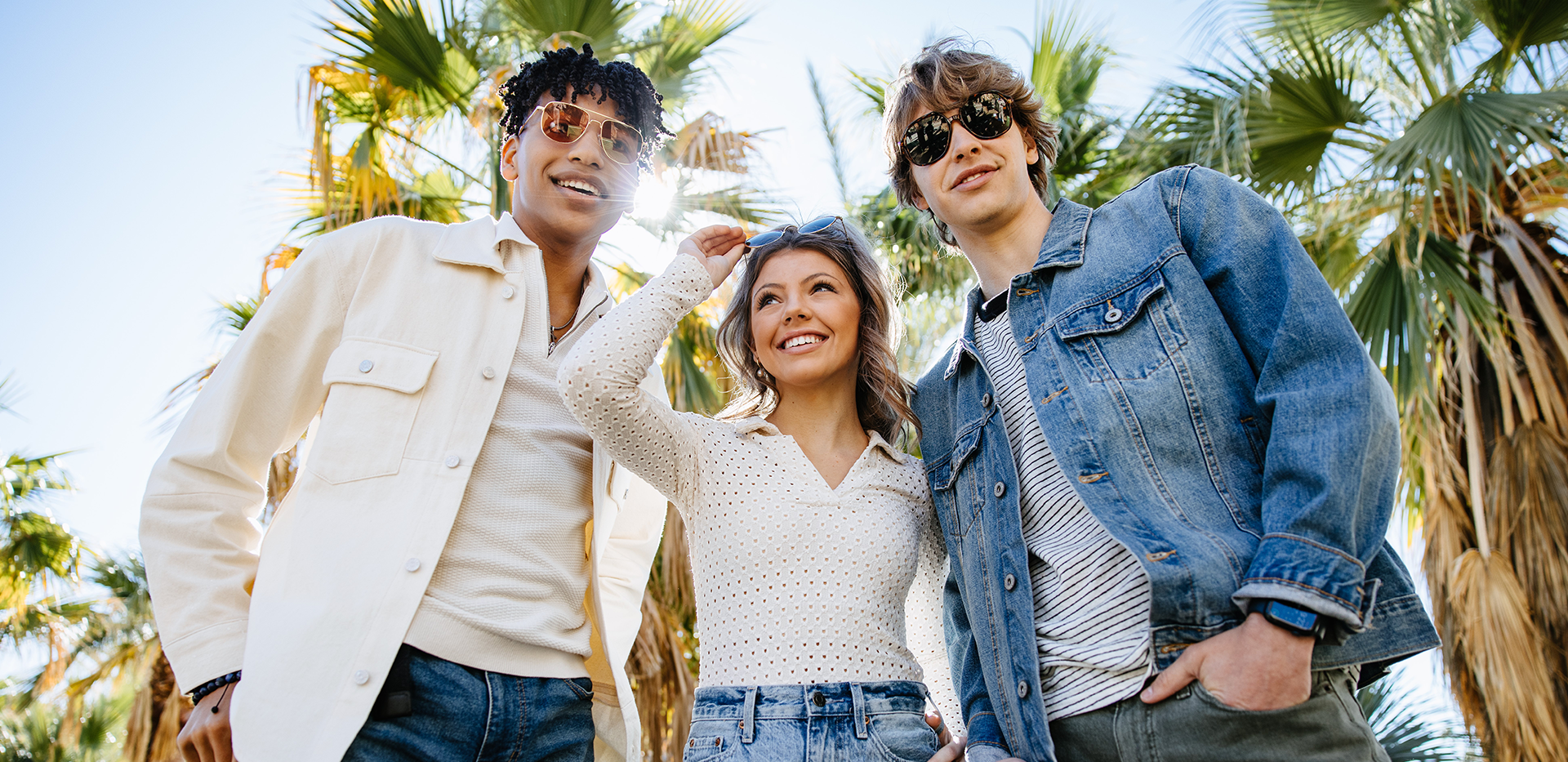 Three teens on a beach