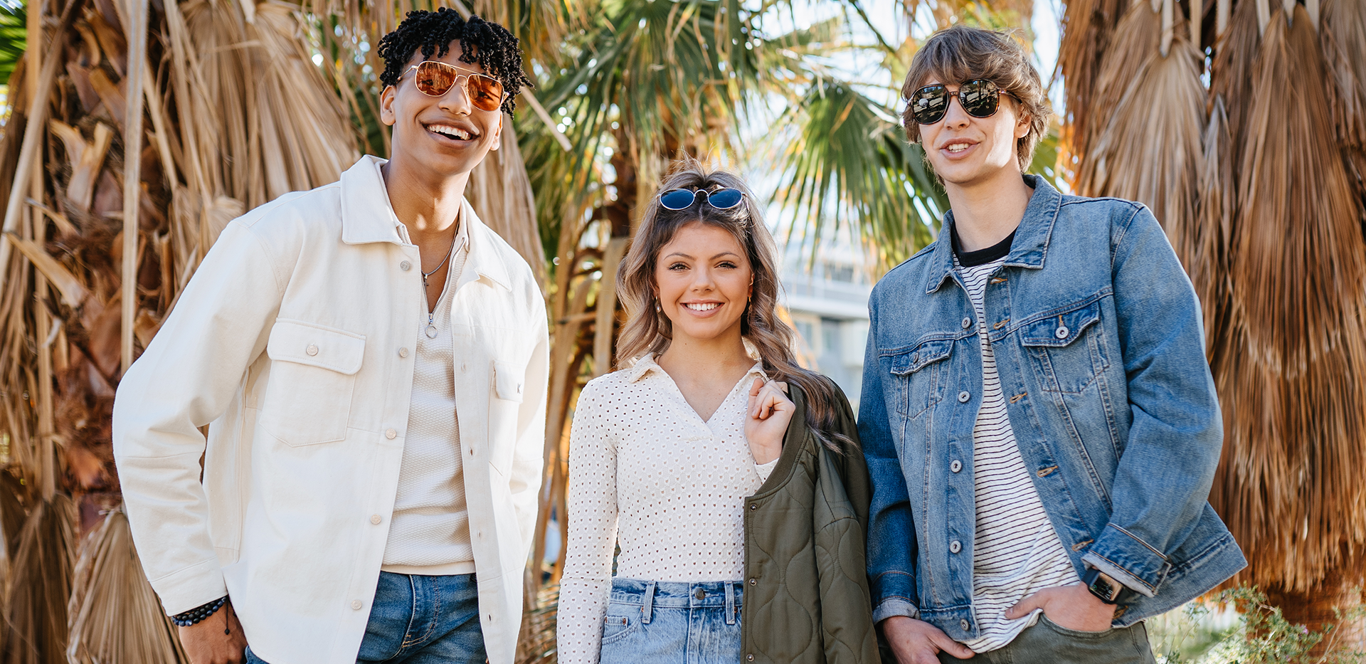 Two men and one girl fashionably dressed