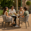 Holt Arm Chair - Natural Weave in an outdoor patio or garden environment