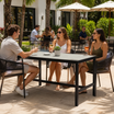 Extrema Cement 'Textured' - Black Mid Height Table in an outdoor patio of a modern restaurant or hotel
