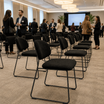 Teddy Stacking Side Chair in a spacious event hall or conference room