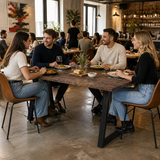 Hardwick 'A' Dining Table - Black - Smoked Oak in a modern restaurant interior
