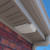 4 inch white under-eave soffit vent installed correctly outside of home