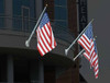 Concord American Outrigger wall mount flagpoles on a building