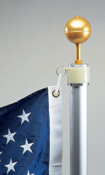 NeverFurl rotating flag mount below the gold ball ornament, with the flag clipped on