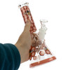 Beehive Glass Beaker Bong with honeycomb and bee pattern held in hand