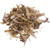 Mad honey-infused blue lotus petals loosely piled on a white background.