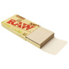 A single pack of Raw 300's Organic Hemp 1 1/4 Rolling Papers, opened.