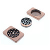 Disassembled, the grinder shows its 2 chambers, or 3 pieces: the top  chamber grinds and features a mesh screen to allow pollen to fall into the second chamber.