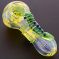A fumed glass critter pipe resting on a dark background to show how the color will change.